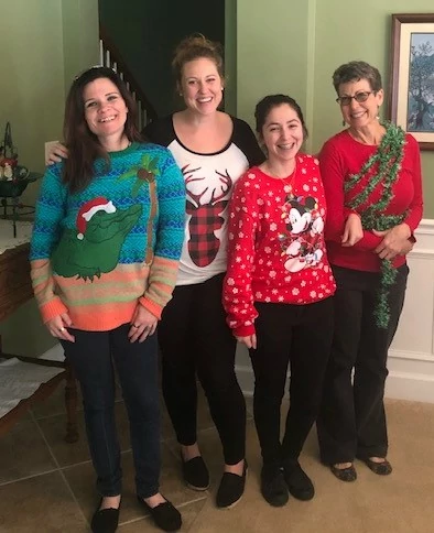 Senior Helpers staff celebrating the 2019 Holiday season with ugly sweaters