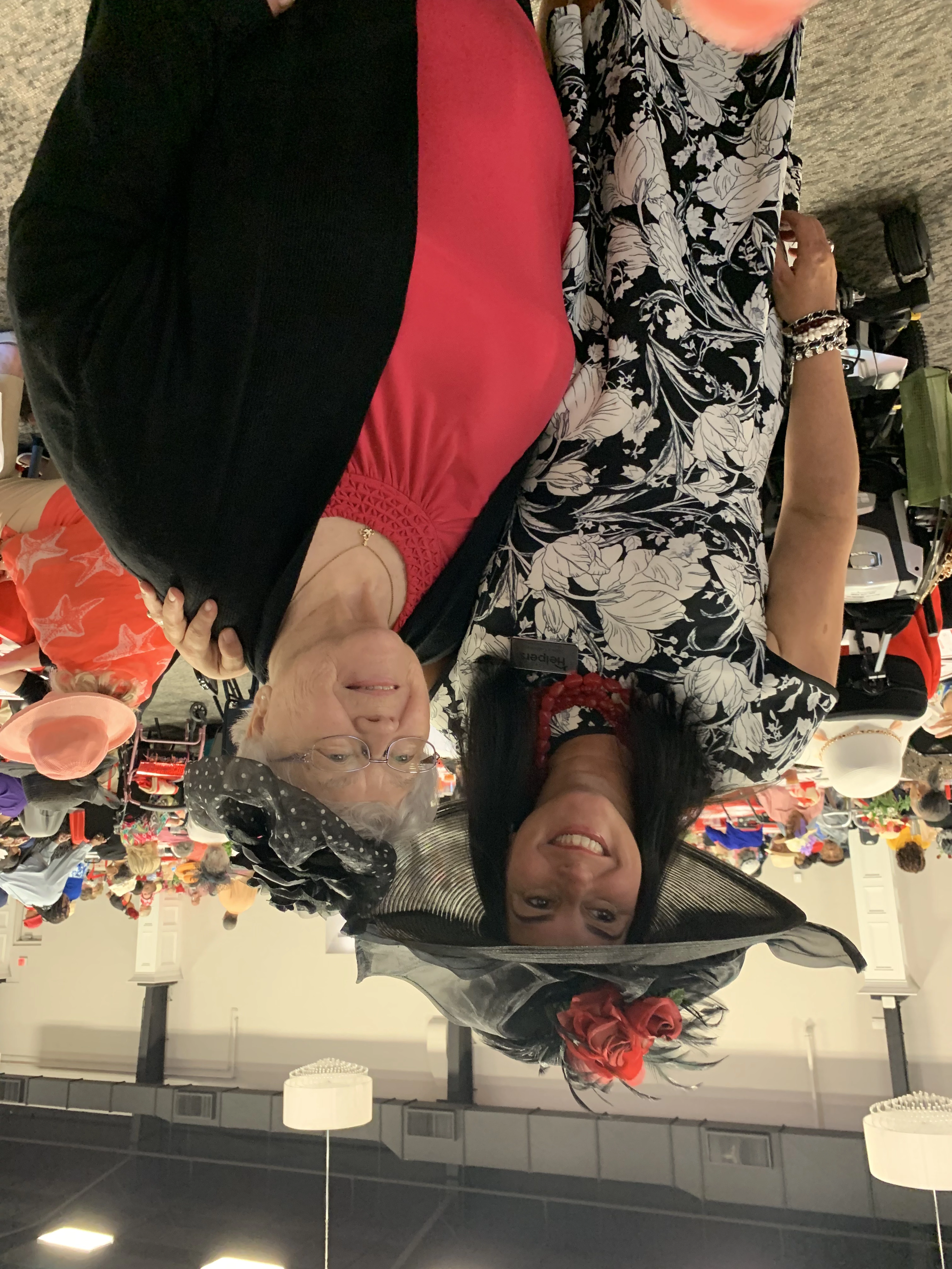 Owner, Nancy Galloway showing off her Derby hat with one of our great clients!