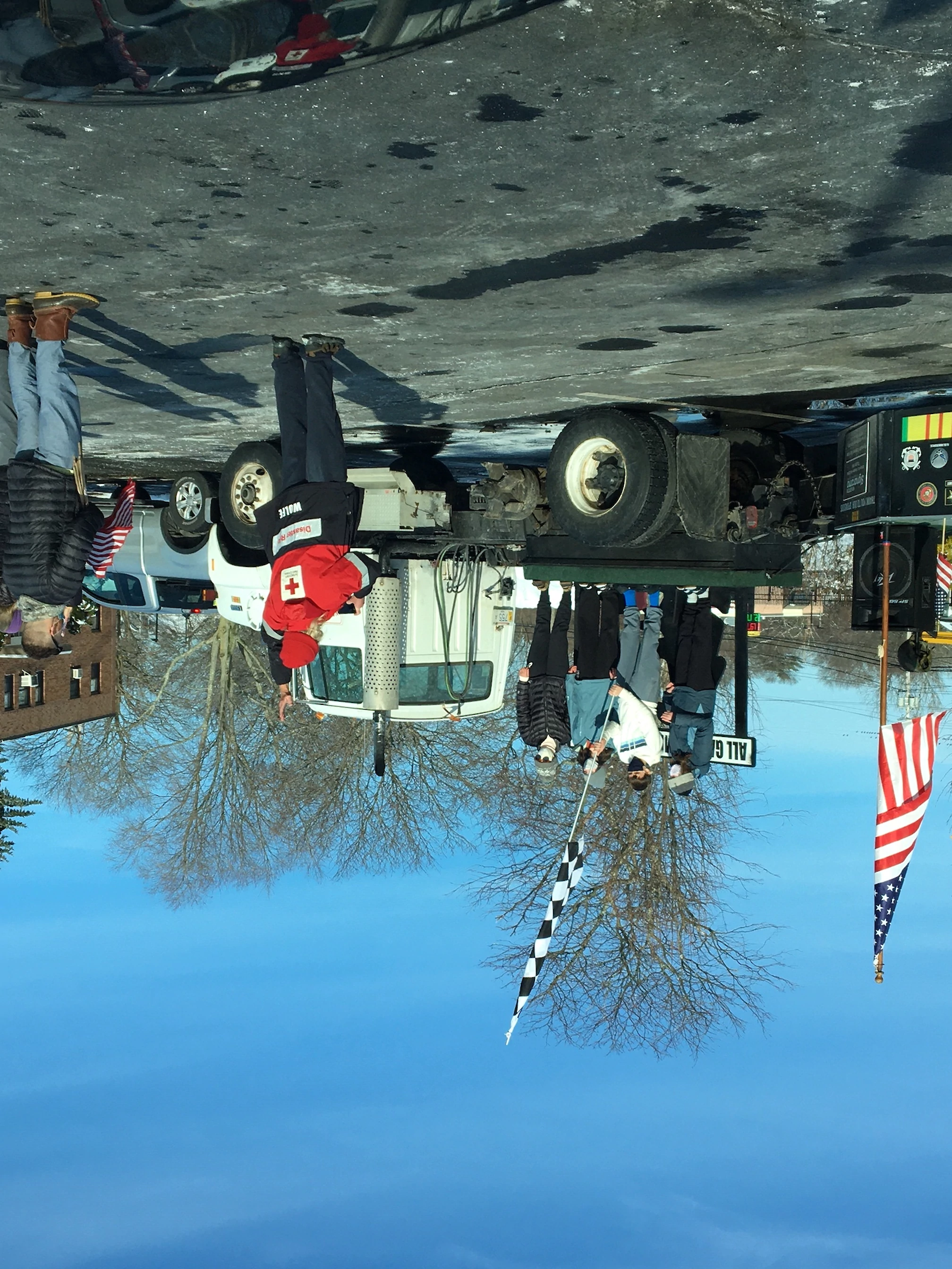 Craig Wolfe, Veteran and advocate, directing the lowering of the checkered flag to start the parade