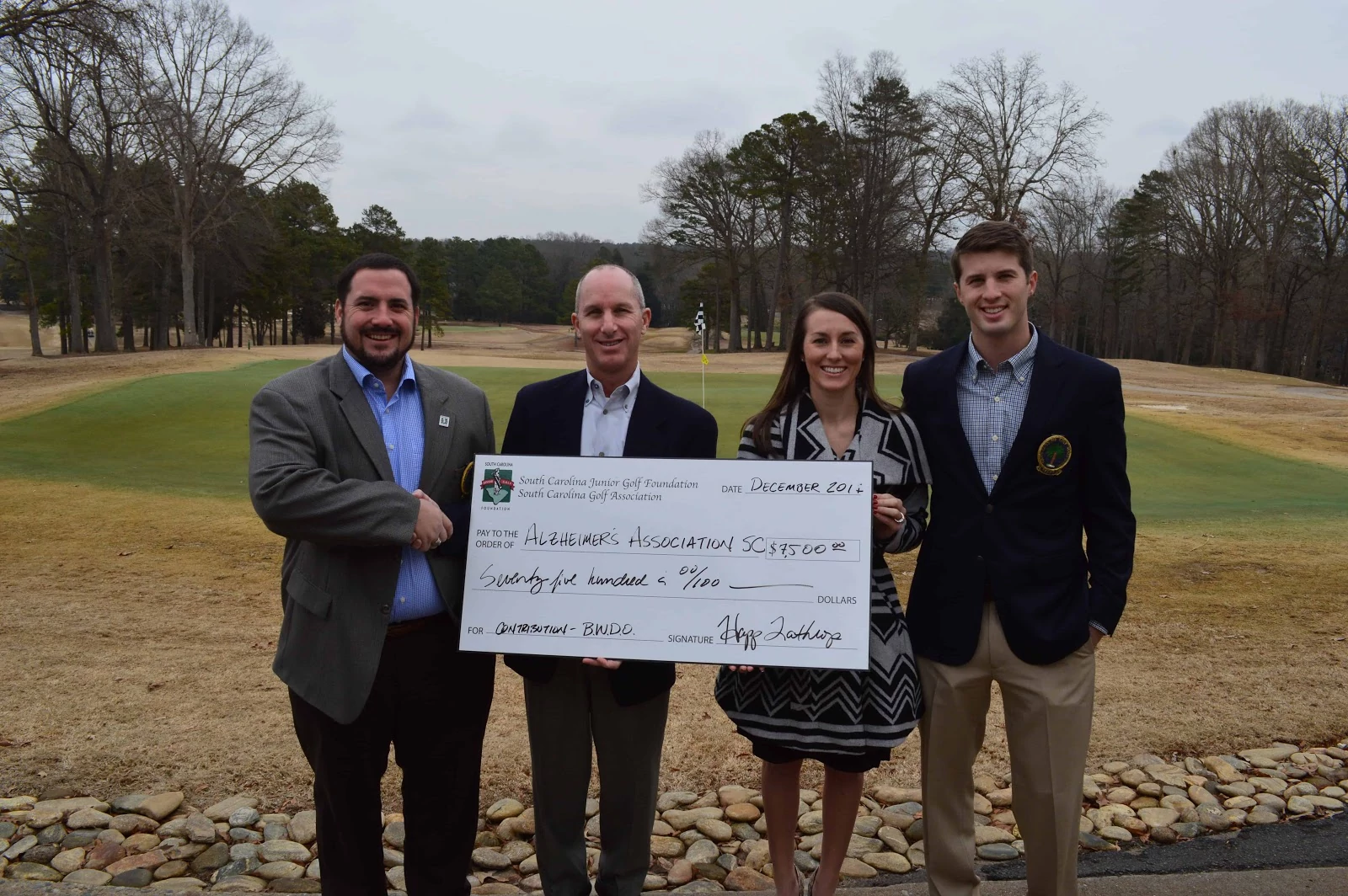 Seth Zamek, Owner/Exec.Dir. of Senior Helpers and Board of Directors member for the South Carolina Alzheimer’s Association, accepts a check on behalf of the Alzheimer’s Association
